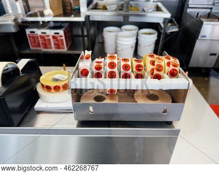 Paris, France - Sep 21, 2022: Five Guys American Fast Food Restaurant With Stickers For Customers Or