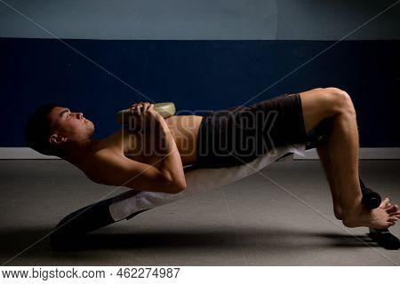 Shirtless 19 Year Old Teenage Boy Doing Situps With Extra Weight