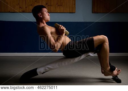 Shirtless 19 Year Old Teenage Boy Doing Situps With Extra Weight