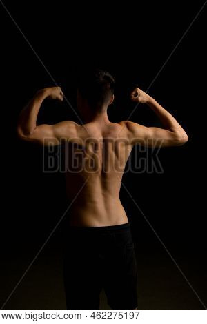 Shirtless 19 Year Old Teenage Boy Flexing His Back Muscles