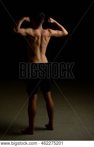 Shirtless 19 Year Old Teenage Boy Flexing His Back Muscles
