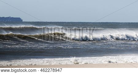 Rough Atlantic Ocean Waves From A Hurricane Far Off The Coast With Heavy Winds Blowing The Water Bac