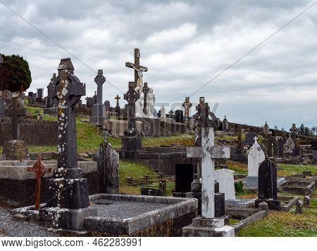 West Cork, Ireland, May 2, 2022. An Old Catholic Cemetery On A Cloudy Spring Day. Stone Tombstones. 