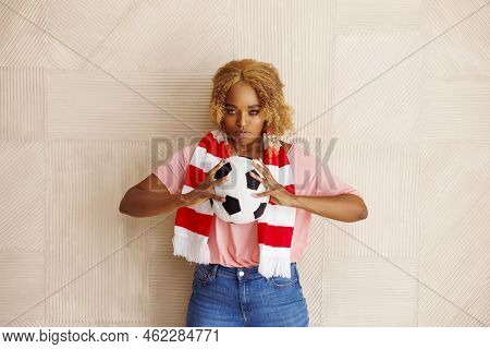 Female Football Fan Holding A Soccer Ball Cheering For Her National Team At The World Championship