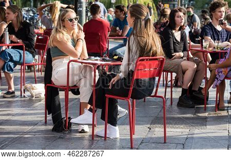 Ixelles, Brussels - Belgium - 10 09 2018 - Young People Having A Drink On A Sunny Terrace On A Late 