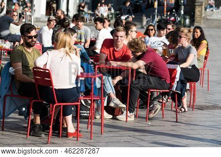 Ixelles, Brussels - Belgium - 10 09 2018 - Young People Having A Drink On A Sunny Terrace On A Late 