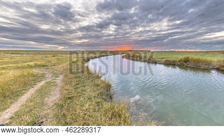 Large Channel In Tidal Marshland Nature Reserve Verdronken Land Van Saeftinghe In Province Of Zeelan