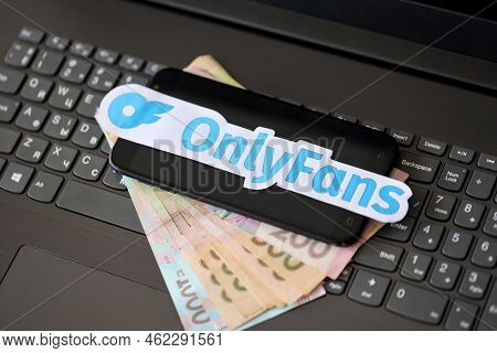 Ternopil, Ukraine - September 6, 2022 Onlyfans Paper Logotype On Bunch Of Ukrainian Hryvnias Bills L