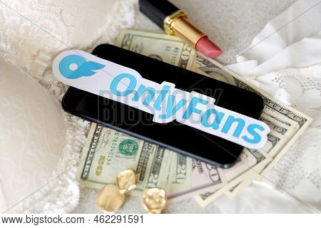 Ternopil, Ukraine - September 6, 2022 Onlyfans Paper Logotype Among Lipstick, Earrings And Women Lin