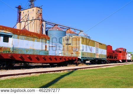 September 20, 2022 In Atchison, Ks:  Vintage Railroad Cars With A Distillery Factory Next To The Tra