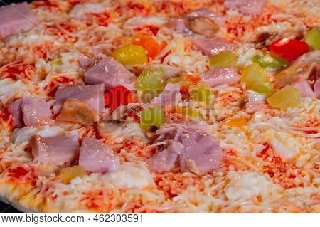 Uncooked Pizza With Ham, Mushroom, Pepper, Cheese In Electric Oven - Close Up View, Macro. Italian C