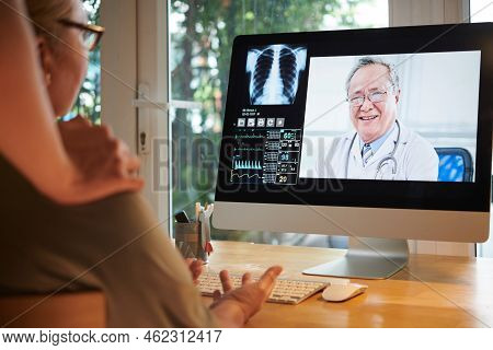 Experienced Doctor Consulting Senior Woman Via Telemedicine Serivce