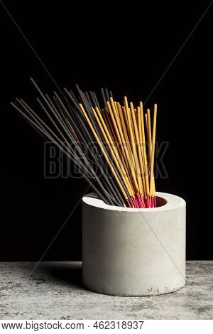 Many Different Aromatic Incense Sticks In Grey Vase