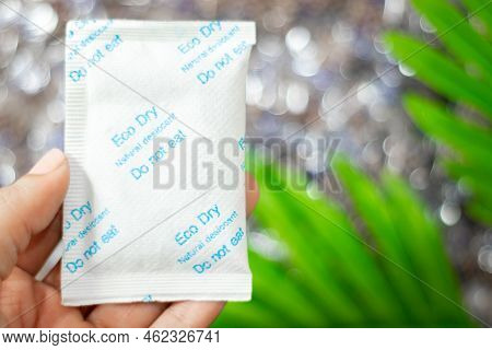 Desiccant Silica On The Pack. Closeup View. Packet Of Silica Gel Buried In Silica Crystals. Written 