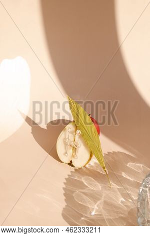 Fruits On A Stand On A Monochromatic Background