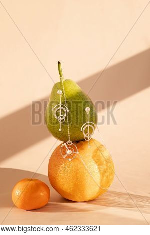 Fruits On A Stand On A Monochromatic Background