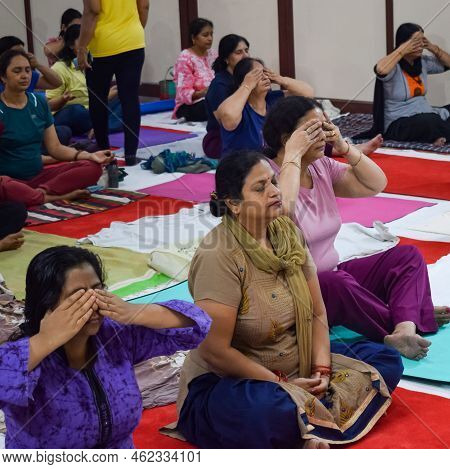 New Delhi, India, June 19 2022 -group Yoga Exercise Session For People Of Different Age Groups In Ba