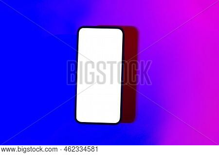 Mobile Phone Mockup In Pink And Purple Light.design Template For Concept Design. Modern Communicatio