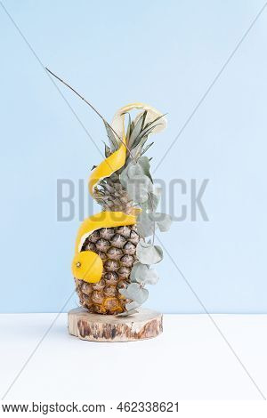 Pineapple In Orange Peel On A Monochromatic Background