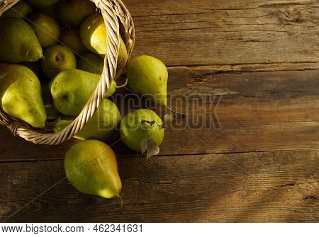 Pears On A Wooden Background. Fruit Harvest. Autumn Still Life. Pear Variety Bera Conference.