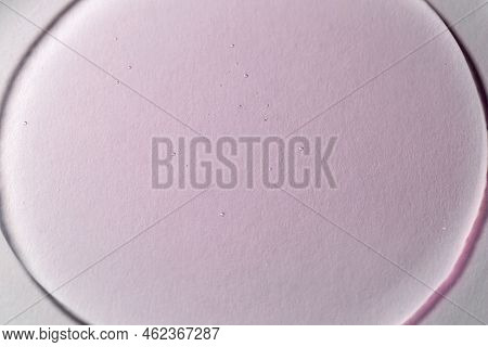Close-up Of A Light Pink Gel-like Liquid. The Concept Of Cosmetic, Medical And Other Laboratory Rese
