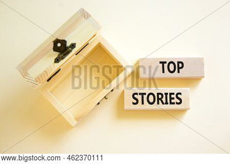 Top Stories Symbol. Concept Words Top Stories On Wooden Blocks On A Beautiful White Table White Back