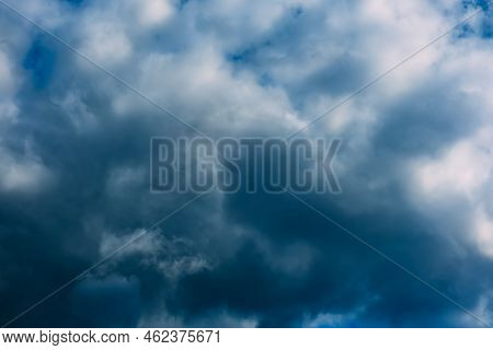 A Dark Blue Cloudy Sky. Cumulus Clouds. Nature Background. Bad Weather Forecast. Before A Thundersto