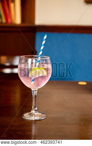 Glass Of Gin And Tonic Cocktail Served In Old Vintage Scottisch Pub, Drinking Gin In Edinburgh, Uk