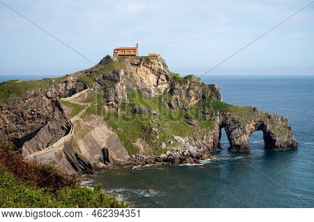 Stone Footpath To Famous Landmark And Film Location In North Of Spain, Ocean Islet With Chapel San J
