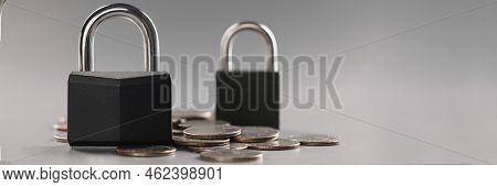 Close-up Of Combination Padlock On Coin Money For Financial Security, Symbol For Protection Finance.