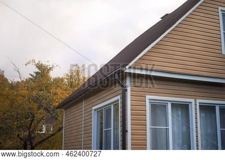 Cladded Front Of Old House Against The Autumn Gray Sky, Outdoor Shot