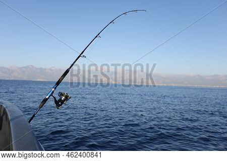 Sea Fishing From Steel Fishing Boat On Open Water. Sunny Day At Sea And Fishing