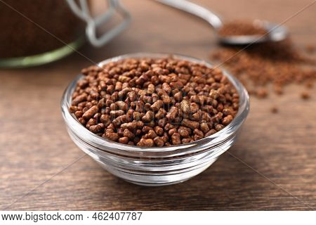 Buckwheat Tea Granules In Glass Bowl On Wooden Table, Closeup