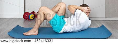 A Strong, Healthy Man With Muscles, Training At Home In The Plank Position. Fitness At Home. Banner