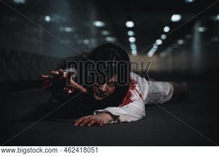 Halloween Day Horror Concept. Asian Woman Zombie With Blood Creepy Crawling Move Slowly Creeping Out