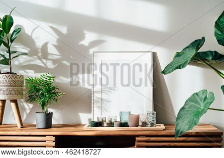 Modern Minimalist Scandinavian Style Interior With White Poster Mockup, Candles And Tropical Green H