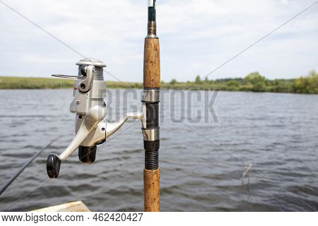 Spinning And Lake. Beach Surfcasting Spinning Fishing Reel And Rod.
