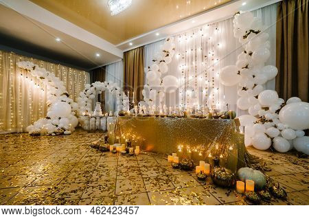 Table Setting For Wedding. Decorated Arch For Wedding Ceremony. White Balloons, Candles, Autumn Leav