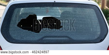 Closeup Of Broken Rear Windshield Glass On The Back Of A Car With No People