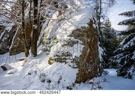 Granite Rock Formation Granicznik Covered By Snow. Winter Forest Of Jizera Mountains, Poland