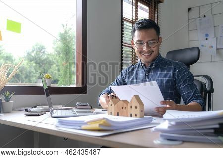 Businessman Hand Using Calculator And Working With Laptop Calculate About Finance Accounting At Coff
