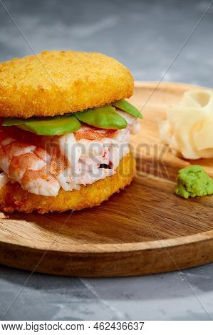 Pan-asian Cuisine Concept. Japanese Sushi Burger Made From Rice Bread, Crab Meat, Avokado And Wasabi