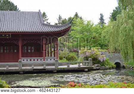 Haren, Netherlands - May 23, 2022: Beautiful View Of Oriental Building Near Pond In Chinese Garden