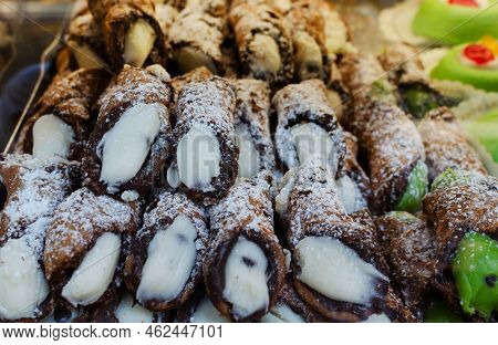 Canolli Sicilian With Pistachio And Ricotta Cream Traditional Italian Sweets. Cookies In The Form Of