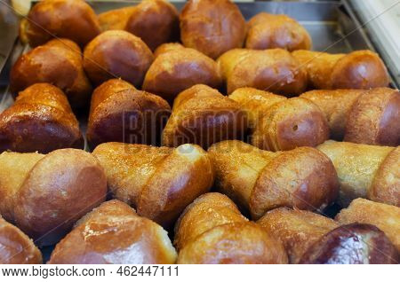 Neapolitan Baba Rum Is A Traditional Italian Sweet. Fluffy Pastries Soaked In Sweet Rum Syrup. The C
