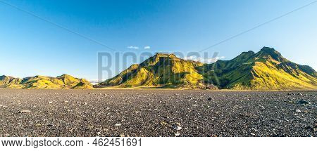 Green Hills And Black Rocky Ground Of Icelandic Highlands Along Laugavegur Hiking Trail, Iceland. Su