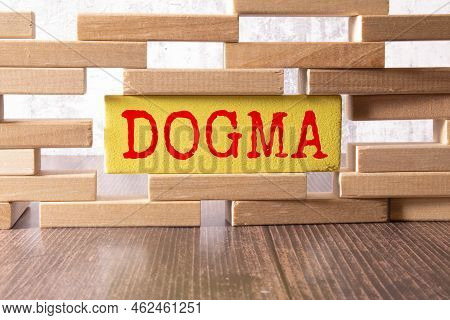 Wooden Blocks With The Text: Dogma. Dogma Word Made With Building Blocks, Business Concept.