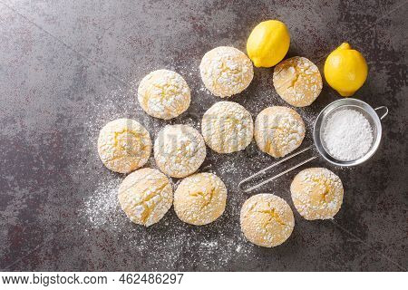 Close-up Of Cracked Lemon Biscuits Sprinkled With Powdered Sugar Close-up On The Table. Horizontal T