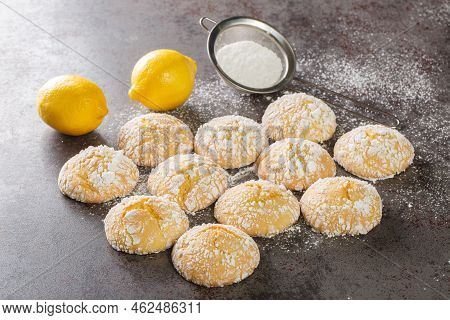 Homemade Lemon Cookies With Cracks And Powdered Sugar Closeup On Table. Horizontal