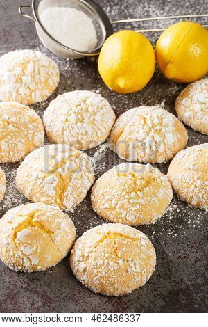 Sweet And Sour Lemon Cookies With Powdered Sugar And Zest Close-up On The Table. Vertical